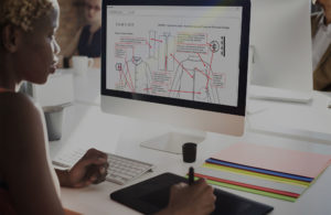 A women using the Bombyx PLM system to help her develop her design at the beginning of its lifecycle process.